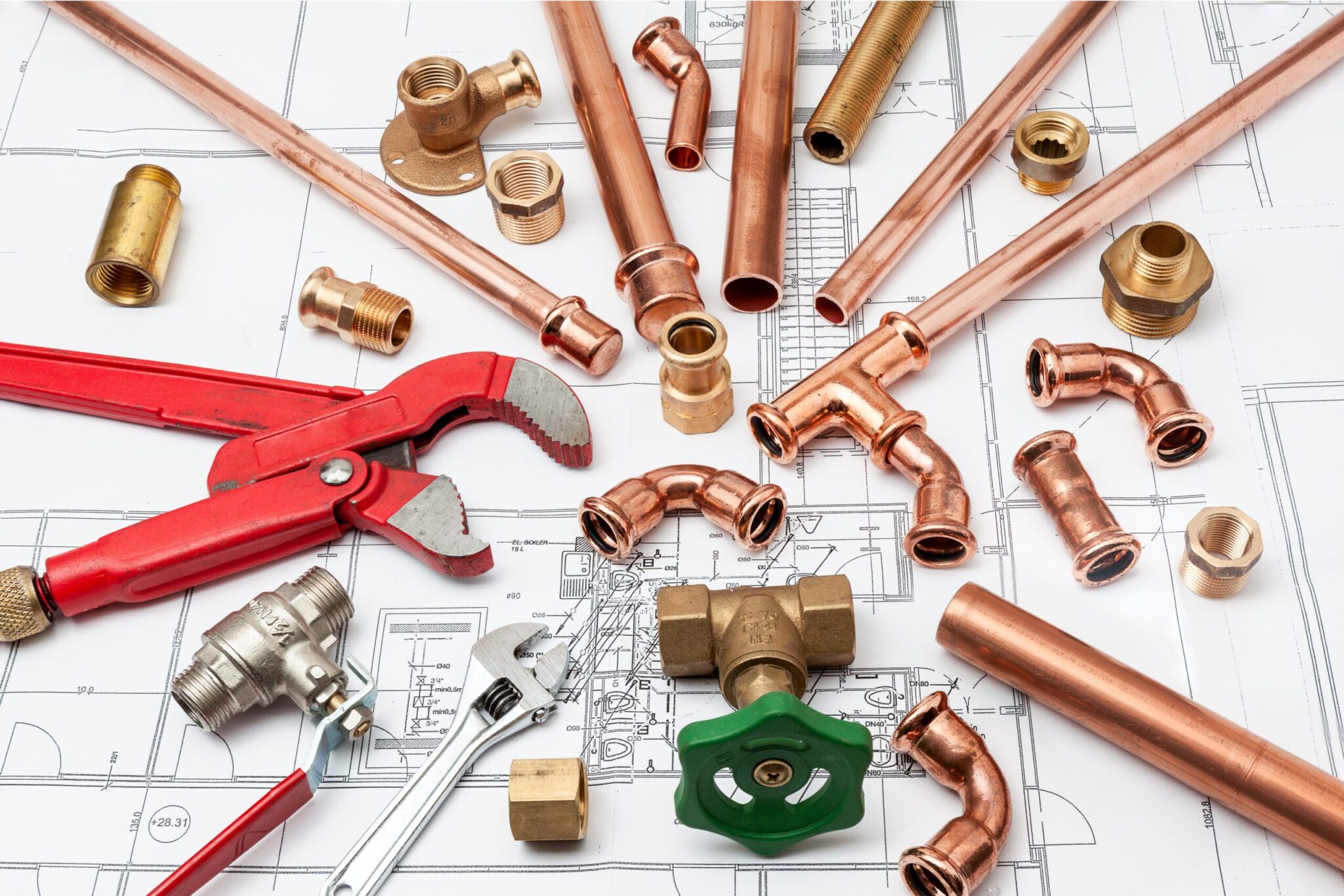 Copper pipes, fittings, valves, and plumbing tools in Holiday